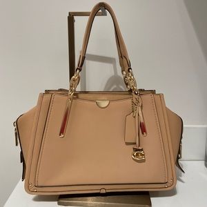 Tan leather “Dreamer” Coach cross body purse